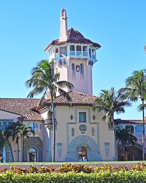 Mar-a-Lago’s tower and facade among palm trees in Palm Beach, Florida