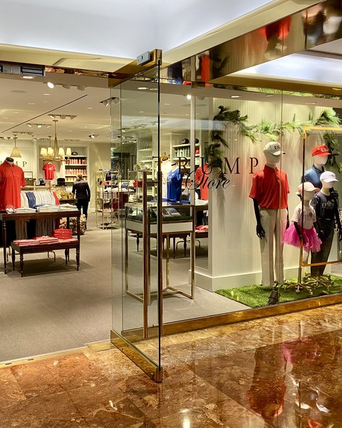The Trump Store inside Trump Tower in New York, with red caps and clothing racks